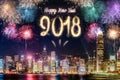 Happy new year 2018 firework over cityscape building near sea at Royalty Free Stock Photo