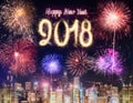 Happy new year 2018 firework over cityscape building near sea at Royalty Free Stock Photo