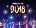 Happy new year 2018 firework over cityscape building near sea at Royalty Free Stock Photo