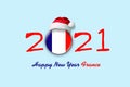 2021. Happy New Year France. Flag of France in a round badge, and in a Santa hat. Isolated on a light blue background. Design Royalty Free Stock Photo