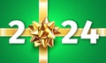 2024 Happy New Year. Gift Box Decoration. Greeting Card with a gold ribbon gift bow and the number 2024 on a green background. New Royalty Free Stock Photo