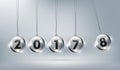 Happy New Year 2018 with glass Newtons cradle, Happy New