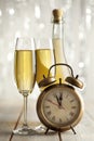 Happy new year - glasses of champagne and clock