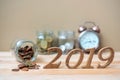 2019 Happy New Year with gold coins stack and wooden number on table. business, investment, retirement planning Royalty Free Stock Photo