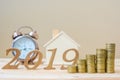 2019 Happy New Year with gold coins stack and wooden number on table. business, investment, retirement planning, finance, Saving a Royalty Free Stock Photo