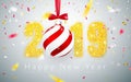 Happy New Year 2019, gold numbers design of greeting card, falling shiny confetti, Xmas ball with red bow, Vector illustration Royalty Free Stock Photo