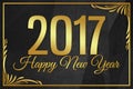 Happy New Year 2017 gold word on black wrinkled paper background