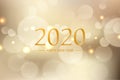 Happy new year 2020 with golden bokeh light sparkling on dark background, Holiday greeting card