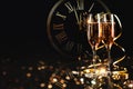 Happy New Year! A golden bucket with champagne, two glasses and a golden serpentine against Royalty Free Stock Photo