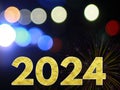 Happy New Year 2024 Golden Shiny Glitter Letter With Firework And Beautiful Bokeh Light On Night Darkness Background.