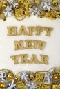 Happy New Year golden text and Christmas decorations on a white Royalty Free Stock Photo