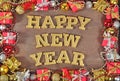 Happy New Year golden text and Christmas decorations Royalty Free Stock Photo