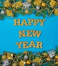 Happy New Year golden text and spruce branch and Christmas decor Royalty Free Stock Photo