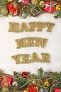 Happy New Year golden text and spruce branch and Christmas decor Royalty Free Stock Photo