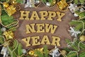 Happy New Year golden text and spruce branch and Christmas decor Royalty Free Stock Photo