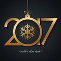 2017 Happy New Year greeting card with golden christmas ball and snowflake on black background. Royalty Free Stock Photo