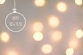 Happy new year greeting card. Golden garland bokeh lights pastel pink gray background. Hand drawn doodle christmas tree ornament b Royalty Free Stock Photo