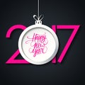 2017 Happy New Year greeting card with handwritten text design and christmas ball. Royalty Free Stock Photo