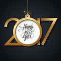 2017 Happy New Year greeting card with handwritten text design and christmas ball. Royalty Free Stock Photo