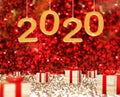 Happy New Year 2020 greeting card and wood present box at red sparkling glitter perspective background,Holiday concept3d Royalty Free Stock Photo