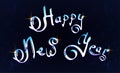 Happy New Year hand-lettering text on blue background