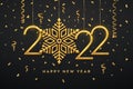 Happy New 2022 Year. Hanging Golden metallic numbers 2022 with shining snowflake and confetti on black background. New Year Royalty Free Stock Photo