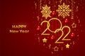 Happy New 2022 Year. Hanging Golden metallic numbers 2022 with shining snowflakes, 3D metallic stars, balls and confetti on red Royalty Free Stock Photo