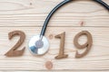 2019 Happy New Year for healthcare, Wellness and medical concept. Stethoscope with wooden number on table Royalty Free Stock Photo