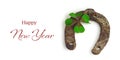 Happy New Year. Horseshoe and shamrock isolated on white background Royalty Free Stock Photo