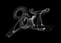 Happy new year 2017 isolated numbers lettering written with white fire flame or smoke on black background Royalty Free Stock Photo