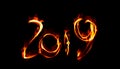 Happy new year 2019 isolated numbers lettering written with white fire flame or smoke on black background Royalty Free Stock Photo