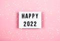 Happy New Year 2022 lletter board light box with christmas decorations and garland sparkling lights.CHristmas and Royalty Free Stock Photo