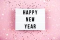 Happy New Year 2022 lletter board light box with christmas decorations and garland sparkling lights.CHristmas and Royalty Free Stock Photo