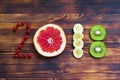 Happy new year 2018 made of fruit and berries on wooden background. Royalty Free Stock Photo