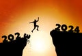 Happy new year 2024. Man silhouette jumping cliff from 2023 to 2024 on cloud sky background