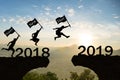 Happy New Year 2019 Men jump over silhouette mountains Royalty Free Stock Photo