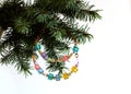 Happy New Year and merry Christmas card beaded letter garland on fir tree brunch Royalty Free Stock Photo