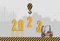 Happy New Year and Merry Christmas concept. Installation of 2023 against the backdrop of a construction site Royalty Free Stock Photo