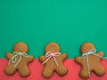 Happy New Year and Merry Christmas gingerbread on red green background. Christmas baking. Making gingerbread christmas cookies. Ch Royalty Free Stock Photo