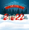 2022 Happy New Year and Merry Christmas holiday background with gift boxes and colorful garland Royalty Free Stock Photo