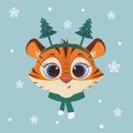 Happy New Year and Merry Christmas. 2022 year of the tiger. Cute tiger in a Christmas tree headband and a scarf on a