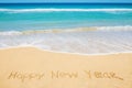 Happy New Year message on the beach