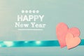 Happy New Year message with pink paper hearts