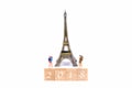 Happy New Year 2018. Miniature Group hiker and traveler backpack standing on wold map for travel Eiffel Tower in France and aroun Royalty Free Stock Photo