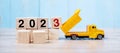 2023 Happy New year with miniature truck or construction vehicle. New Start, Vision, Resolution, goal, industrial, Warehouse Royalty Free Stock Photo