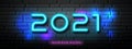 2021 Happy New Year, Neon Light number design on block wall black background Royalty Free Stock Photo