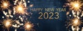 HAPPY NEW YEAR 2023 Party background greeting card - Sparklers and bokeh lights, on dark blue night sky