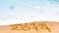 Happy New Year 2014 replace 2013 concept on the sea beach Royalty Free Stock Photo