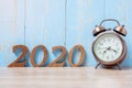 2020 Happy New Year with retro alarm clock and wooden number. New Start, Resolution, Goals, Plan, Action and Mission Concept