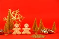 Happy New Year`s 2022, Christmas set of gingerbread man and woman in face mask and red gold decorations on classic traditional re Royalty Free Stock Photo